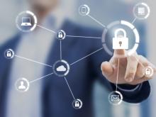 A business person pointing at an image of a lock